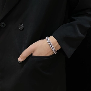 Close-up of Cuban link bracelet featuring pink and purple glaze on silver stainless steel