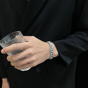 Detail of Cuban chain bracelet with blue marble enamel on stainless steel band