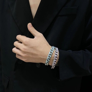 Hip hop style Cuban link bracelets in light blue and purple enamel on a black blazer