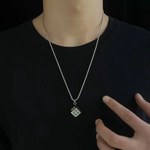 Hip hop titanium steel necklace featuring a silver dice pendant with a yellow smiley face