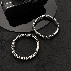Men's titanium steel square braid bracelet with magnetic clasp on a black background