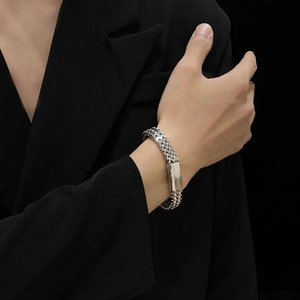 Men's titanium steel square franco chain bracelet with magnetic clasp on black suit