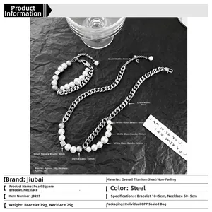 Close-up of double-layered cuban pearl necklace set on black background