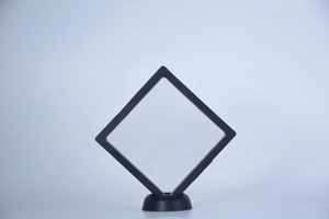 Minimalist square black PE film jewelry display frame with a circular support base