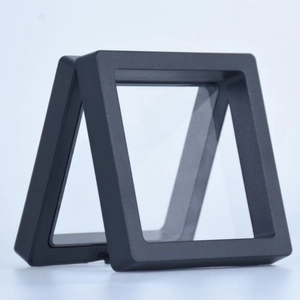 Square black PE film suspension display boxes for jewelry and coins on light background