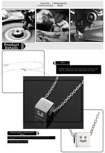 Detail of titanium steel cube pendant featuring laser engraved smileys and lobster clasp closure