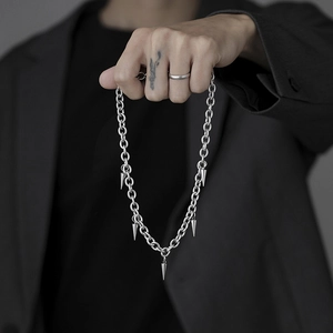 Titanium steel punk necklace featuring five silver spiked pendants on a classic ring chain