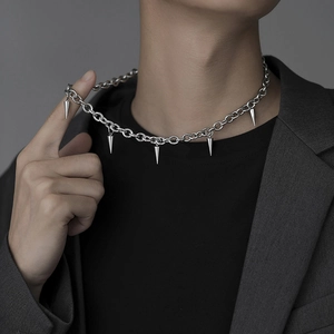 Detail of titanium steel punk necklace featuring solid metal spikes and heavy link chain