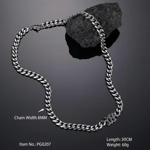 Detail of 8mm wide stainless steel Cuban chain necklace on black volcanic stone