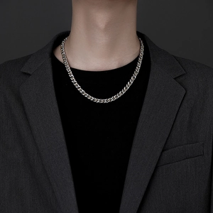 Polished silver cuban link chain for men in stainless steel styled with business attire