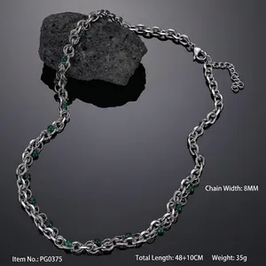 Detail view of 8mm thick stainless steel chain with green bead on volcanic stone