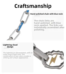 Close-up of a stainless steel chain featuring a lightning bolt and blue wave cloud pendant