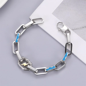 Bracelet chaîne en acier inoxydable avec maillons en émail bleu et breloque éclair dorée