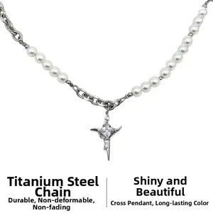 Detail of titanium steel chain with pearl splicing and star cross pendant with zircon
