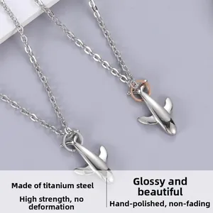 Polished titanium steel airplane pendant with O-chain and glossy mirror finish detail