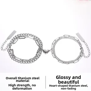 Detail of magnetic heart charms and titanium steel chains for couple bracelets