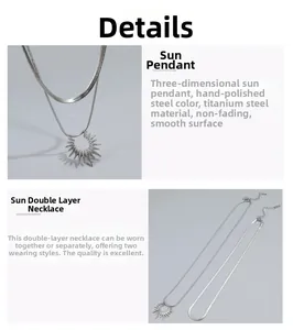 Detail of silver stainless steel sun pendant on a double layered snake bone chain necklace