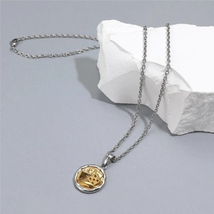 Detail of dice and poker relief pendant on O-chain necklace with metallic luster