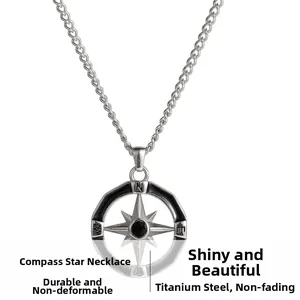Detailed close-up of titanium steel compass star pendant with black gemstone and chain