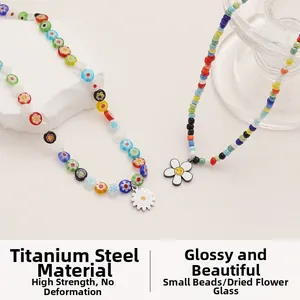 Detailed close-up of colorful daisy necklaces made of glass beads and titanium steel