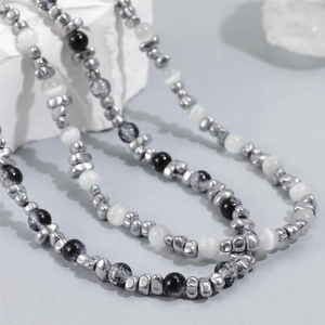 Minimalist pearl necklace with irregular silver beads and black marble stones