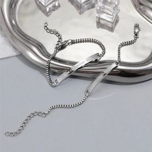 Titanium steel couple bracelets with 'You Complete Me' engraving on silver metal plate