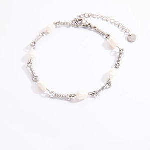Detailed macro view of 18K gold plated stainless steel chain with natural freshwater pearls