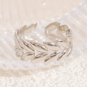 Detail view of adjustable silver leaf ring with high-polish wheat ear textured finish