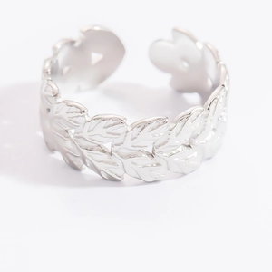Detailed view of silver leaf pattern open ring with polished adjustable metal band