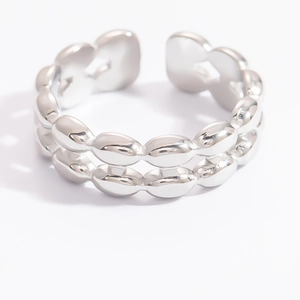 Macro view of polished silver leaf style double layer open ring with mirror finish