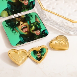 Detail of custom heart locket necklace in 18K gold finish with personalized photo