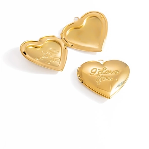 Detail of 18K gold plated heart locket pendant with I Love You engraved lettering