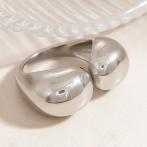 Macro shot of silver high-polished adjustable ring with irregular organic sphere design