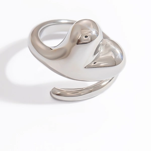 Macro shot of silver swan-shaped ring with minimalist smooth lines and open adjustable band