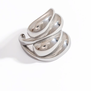 Detailed macro view of the layered liquid metal wave design on a silver ring