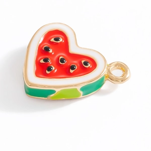 Detail showing heart-shaped watermelon enamel charm with gold plated alloy base