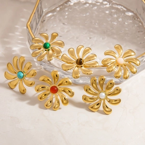 Macro shot of 18k gold plated stainless steel flower rings with colorful natural stones