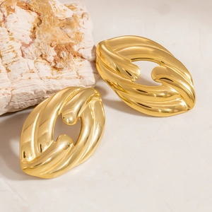 Irregular oval earrings with 18k gold plating and spiral liquid metal texture design