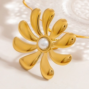 18k gold plated stainless steel ring with 10-petal floral design and large pearl center
