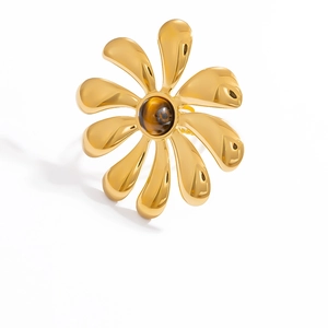 Detail of 18k gold plated stainless steel flower ring with center round tiger eye stone