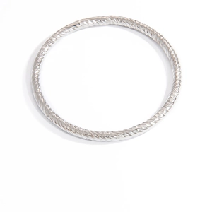 Elegant silver twisted stainless steel bangle with starry wave texture on white background