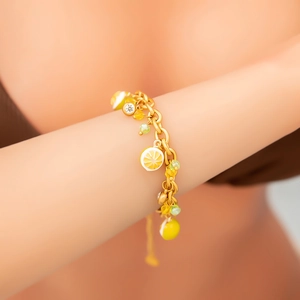 Bracelet luxueux en acier inoxydable plaqué or 18K avec breloques citron et cristaux