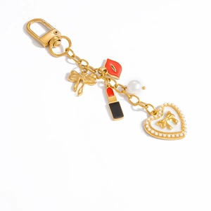 18K gold plated keychain with pearl charms, lipstick, and red lip pendant on white background