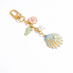 Ocean themed gold keychain with starfish, seahorse, pearl and scallop shell charms
