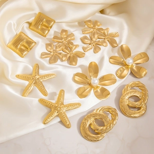 Elegant 18K gold-plated stainless steel flower and pearl earring set on white silk