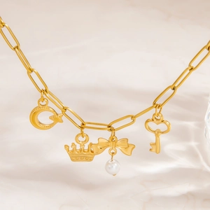 18K gold plated stainless steel bracelet with heart, pearl, and key charms on a chain
