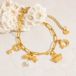 18K gold plated stainless steel bracelet with pearl bow, crown and key charms