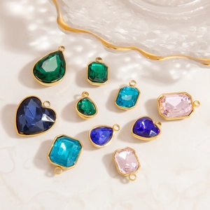 Faceted glass crystal teardrop and heart pendants with gold plated metal bezels