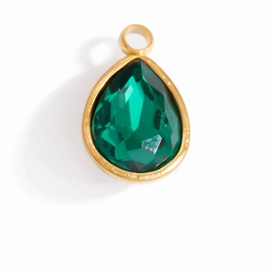 Detailed view of teardrop emerald green crystal pendant with gold-plated bezel for DIY jewelry