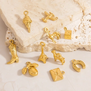 Polished 18K gold plated stainless steel charms including Eiffel tower and dice for DIY jewelry